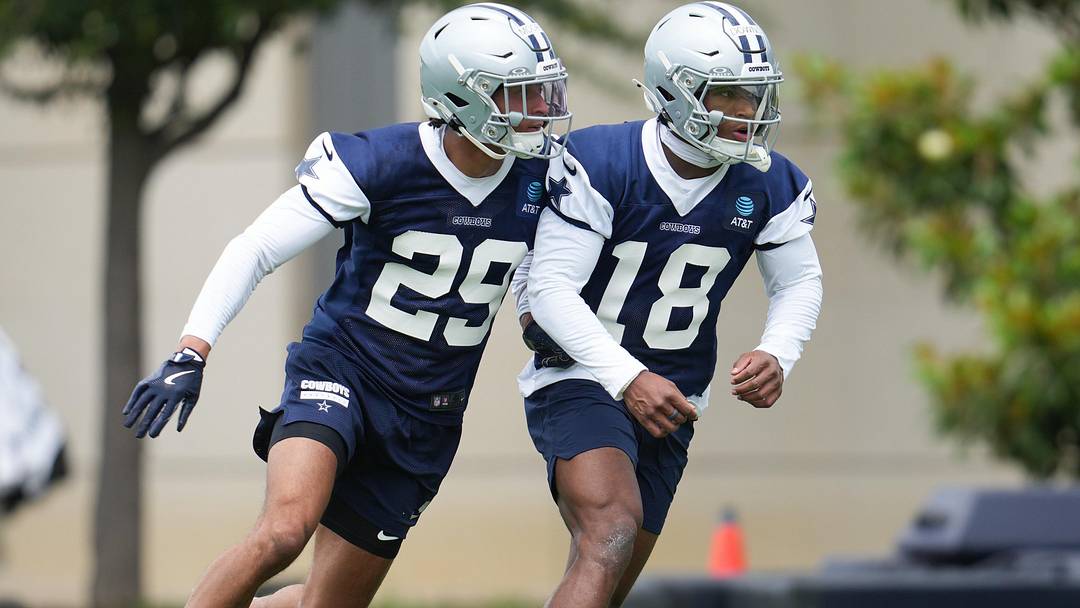Dallas Cowboys cornerback Devin Moore and Dallas Cowboys safety Caleb Downs go through a drill during practice. Dallas Cowboys cornerback Devin Moore and Dallas Cowboys safety Caleb Downs go through a drill during practice.
