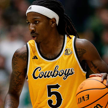Feb 15, 2025; Fort Collins, Colorado, USA; Wyoming Cowboys guard Obi Agbim (5) dribbles the ball up court in the first half against the Colorado State Rams at Moby Arena. Mandatory Credit: Isaiah J. Downing-Imagn Images