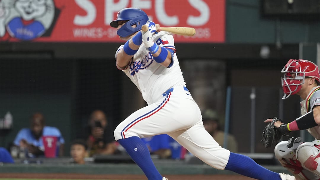 Sep 7, 2024; Arlington, Texas, USA; Texas Rangers third baseman Josh Jung (6) follows through on his single against the Los Angeles Angels during the sixth inning at Globe Life Field. Sep 7, 2024; Arlington, Texas, USA; Texas Rangers third baseman Josh Jung (6) follows through on his single against the Los Angeles Angels during the sixth inning at Globe Life Field.
