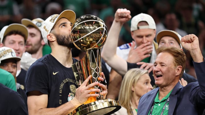 Boston Celtics forward Jayson Tatum (0) kisses the trophy after winning the 2024 NBA Finals against the Dallas Mavericks at TD Garden on June 17.