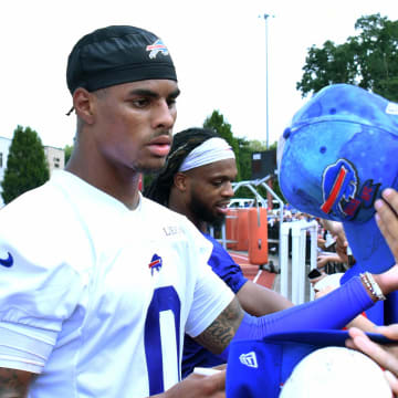 Jul 24, 2024; Rochester, NY, USA; Buffalo Bills wide receiver Keon Coleman (0) signs autographs for fans after a training camp session at St. John Fisher University. Mandatory Credit: Mark Konezny-USA TODAY Sports