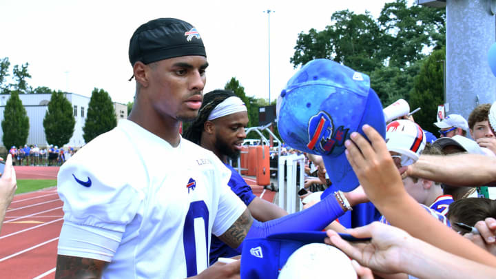 Jul 24, 2024; Rochester, NY, USA; Buffalo Bills wide receiver Keon Coleman (0) signs autographs for fans after a training camp session at St. John Fisher University. Mandatory Credit: Mark Konezny-USA TODAY Sports