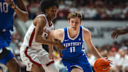 Feb 22, 2025; Tuscaloosa, Alabama, USA; Kentucky Wildcats guard Travis Perry (11) drives the ball against Alabama Crimson Tide guard Aden Holloway (2) during the second half at Coleman Coliseum. Mandatory Credit: Will McLelland-Imagn Images
