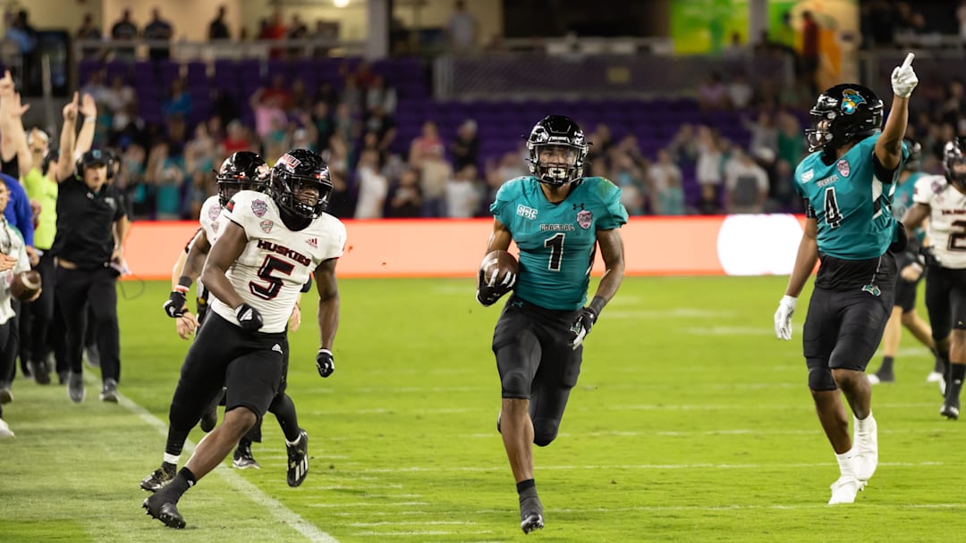 Dec 17, 2021; Orlando, Florida, USA; Coastal Carolina Chanticleers running back Braydon Bennett (1) rushes for a touchdown during the second half against the Northern Illinois Huskies during the 2021 Cure Bowl at Exploria Stadium. Mandatory Credit: Matt Pendleton-Imagn Images