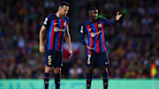 Sergi Busquets y Ousmane Dembélé
