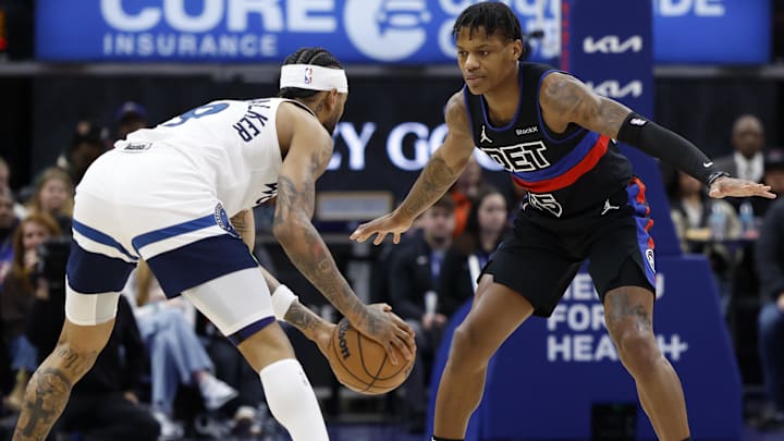  Minnesota Timberwolves guard Nickeil Alexander-Walker (9) is defended by Detroit Pistons guard Marcus Sasser (25) in the first half at Little Caesars Arena.