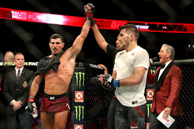 Nordine Taleb (red gloves) celebrates beating Kyle Prepolec (blue gloves) during UFC Fight Night at Canadian Tire Centre. 