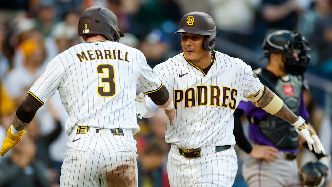 Apr 11, 2026; San Diego, California, USA; San Diego Padres third baseman Manny Machado (13) celebrates with  center fielder Jackson Merrill (3) after hitting a two-run home run during the third inning against the Colorado Rockies  at Petco Park. Mandatory Credit: David Frerker-Imagn Images