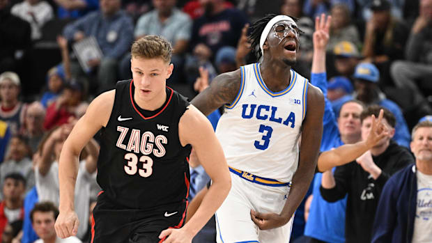 UCLA Bruins guard Eric Dailey Jr. (3) and Gonzaga Bulldogs forward Ben Gregg (33). 