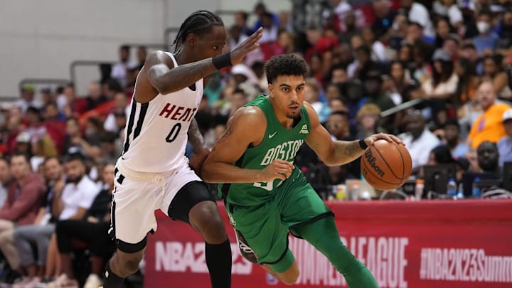 Jul 9, 2022; Las Vegas, NV, USA; Boston Celtics guard Brodric Thomas (97) dribbles against Miami Heat guard Marcus Garrett (0) during an NBA Summer League game at Cox Pavilion. Mandatory Credit: Stephen R. Sylvanie-Imagn Images