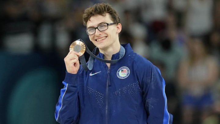 Stephen Nedoroscik of the United States poses for a photo with his bronze medal on the pommel horse during the 2024 Paris Olympics. 