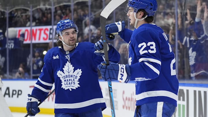 Dec 27, 2025; Toronto, Ontario, CAN; Toronto Maple Leafs forward Matias Maccelli (63) congratulates forward Matthew Knies (23) after his goal against the Ottawa Senators during the third period at Scotiabank Arena. Mandatory Credit: John E. Sokolowski-Imagn Images