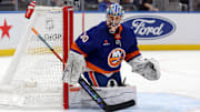 Mar 24, 2025; Elmont, New York, USA; New York Islanders goaltender Ilya Sorokin (30) plays the puck against the Columbus Blue Jackets during the first period at UBS Arena. Mandatory Credit: Brad Penner-Imagn Images
