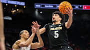 Mar 13, 2025; Kansas City, MO, USA; Colorado Buffaloes guard RJ Smith (5) drives to the basket during the second half against the Houston Cougars at T-Mobile Center. Mandatory Credit: William Purnell-Imagn Images