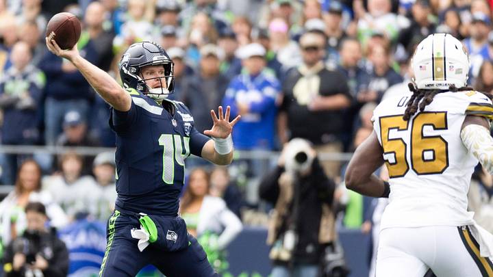 Sep 21, 2025; Seattle, Washington, USA; Seattle Seahawks quarterback Sam Darnold (14) throws the ball during the first quarter against New Orleans Saints at Lumen Field. 