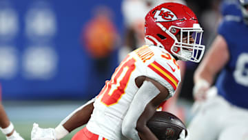 Sep 21, 2025; East Rutherford, New Jersey, USA; Kansas City Chiefs cornerback Christian Roland-Wallace (30) intercepts a pass against the New York Giants in the second quarter at MetLife Stadium. Mandatory Credit: Vincent Carchietta-Imagn Images