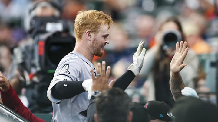 Sep 8, 2024; Houston, Texas, USA; Arizona Diamondbacks left fielder Pavin Smith (26) celebrates in the dugout after hitting a home run during the second inning against the Houston Astros at Minute Maid Park.