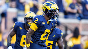 Michigan defensive back Will Johnson (2) celebrates a touchdown after intercepting USC quarterback Miller Moss (7) during the second half at Michigan Stadium in Ann Arbor on Saturday, Sept. 21, 2024.