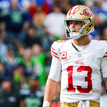 Sep 7, 2025; Seattle, Washington, USA; San Francisco 49ers quarterback Brock Purdy (13) reacts following a failed third down play against the Seattle Seahawks during the fourth quarter at Lumen Field. Mandatory Credit: Joe Nicholson-Imagn Images