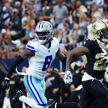 New Orleans Saints wide receiver Rashid Shaheed (22) catches a touchdown past Dallas Cowboys safety Donovan Wilson (6)  