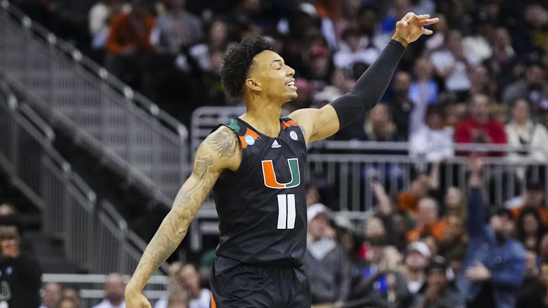 Mar 24, 2023; Kansas City, MO, USA; Miami Hurricanes guard Jordan Miller (11) celebrates after a 3-pointer during the second half of an NCAA tournament Midwest Regional semifinal against the Houston Cougars at T-Mobile Center. Mandatory Credit: Jay Biggerstaff-Imagn Images