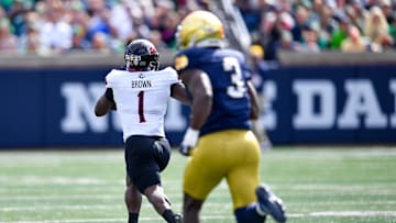 Sep 7, 2024; South Bend, Indiana, USA; Northern Illinois Huskies running back Antario Brown (1) catches a pass for a touchdown as Notre Dame Fighting Irish linebacker Jaylen Sneed (3) pursues in the first quarter at Notre Dame Stadium