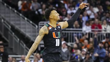 Mar 24, 2023; Kansas City, MO, USA; Miami Hurricanes guard Jordan Miller (11) celebrates after a 3-pointer during the second half of an NCAA tournament Midwest Regional semifinal against the Houston Cougars at T-Mobile Center. Mandatory Credit: Jay Biggerstaff-Imagn Images