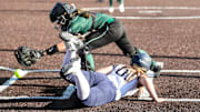 Susquehanna Valley's Kylee Richardson slides into home to score as the ball gets away from Hannah Fagan of Marcellus in the Mustangs' 5-3 win in a NYSPHSAA Class B softball regional final at Greenlight Networks Grand Slam Park in Binghamton on May 31, 2024.
