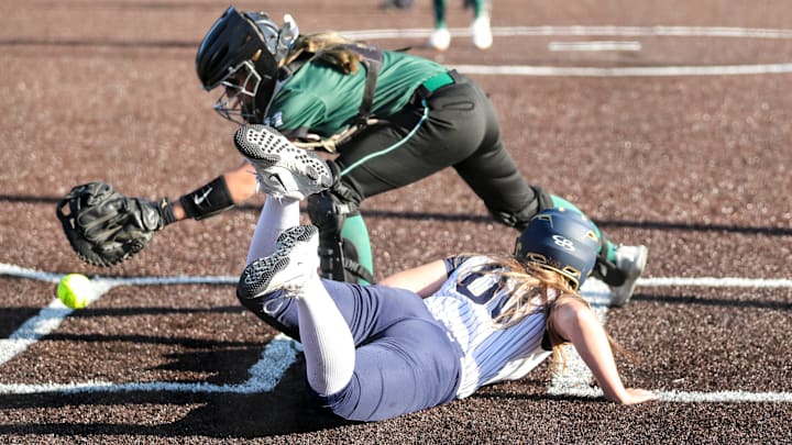 Susquehanna Valley's Kylee Richardson slides into home to score as the ball gets away from Hannah Fagan of Marcellus in the Mustangs' 5-3 win in a NYSPHSAA Class B softball regional final at Greenlight Networks Grand Slam Park in Binghamton on May 31, 2024. Susquehanna Valley's Kylee Richardson slides into home to score as the ball gets away from Hannah Fagan of Marcellus in the Mustangs' 5-3 win in a NYSPHSAA Class B softball regional final at Greenlight Networks Grand Slam Park in Binghamton on May 31, 2024.