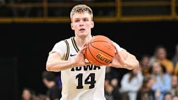 Nov 20, 2025; Iowa City, Iowa, USA; Iowa Hawkeyes guard Bennett Stirtz (14) passes the ball against the Chicago State Cougars during the second half at Carver-Hawkeye Arena. Mandatory Credit: Jeffrey Becker-Imagn Images