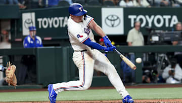Apr 5, 2025; Arlington, Texas, USA; Texas Rangers left fielder Wyatt Langford (36) hits a two-run home run during the seventh inning against the Tampa Bay Rays at Globe Life Field. 