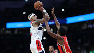 Dec 13, 2023; Washington, District of Columbia, USA; Washington Wizards forward Kyle Kuzma (33) shoots the ball over New Orleans Pelicans forward Herbert Jones (5) in the second quarter at Capital One Arena. Mandatory Credit: Geoff Burke-Imagn Images