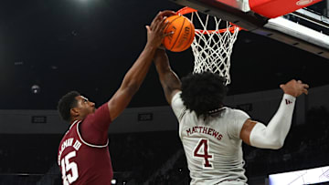 Feb 18, 2025; Starkville, Mississippi, USA; Texas A&M Aggies forward Henry Coleman III (15) and Mississippi State Bulldogs forward Cameron Matthews (4) reach for a rebound during the first half at Humphrey Coliseum. Mandatory Credit: Petre Thomas-Imagn Images
