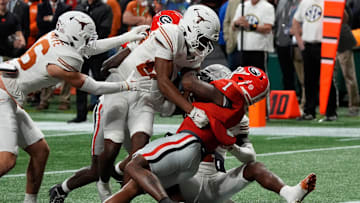 Georgia running back Trevor Etienne (1) powers in for a touchdown during the second half of the SEC championship game against Texas in Atlanta, on Saturday, Dec. 7, 2024.