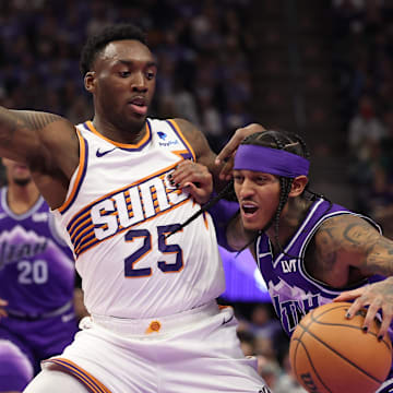 Nov 17, 2023; Salt Lake City, Utah, USA; Utah Jazz guard Jordan Clarkson (00) drives the all defended by Phoenix Suns forward Nassir Little (25) in the fourth quarter at Delta Center. Mandatory Credit: Rob Gray-Imagn Images