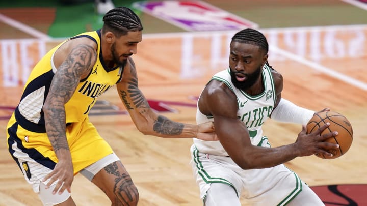 May 21, 2024; Boston, Massachusetts, USA; Boston Celtics guard Jaylen Brown (7) dribbles the ball against Indiana Pacers forward Obi Toppin (1) in the first half for game one of the eastern conference finals for the 2024 NBA playoffs at TD Garden. Mandatory Credit: David Butler II-USA TODAY Sports