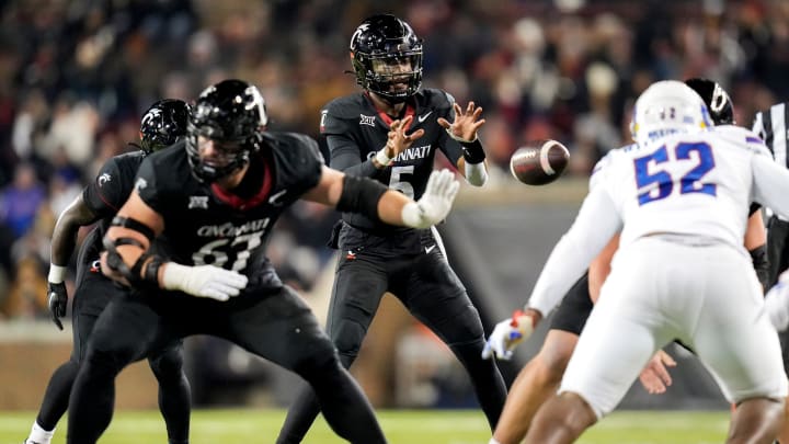 Cincinnati Bearcats quarterback Emory Jones (5) receives a snap during the NCAA college football game between the Cincinnati Bearcats and Kansas Jayhawks on Saturday, Nov. 25, 2023, at Nippert Stadium in Cincinnati. Kansas won 49-16.