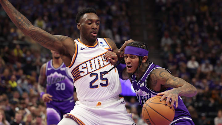 Nov 17, 2023; Salt Lake City, Utah, USA; Utah Jazz guard Jordan Clarkson (00) drives the all defended by Phoenix Suns forward Nassir Little (25) in the fourth quarter at Delta Center. Mandatory Credit: Rob Gray-Imagn Images