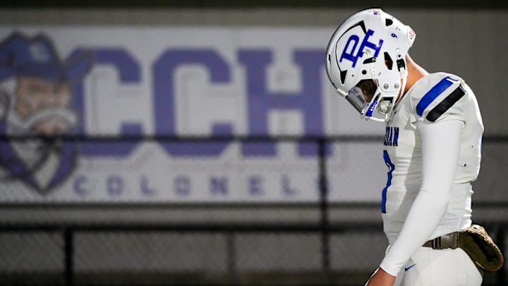 Paducah Tilghman Blue Tornado take the field before the KHSAA Class 4A state semifinals high school football game between the Covington Catholic Colonels and Paducah Tilghman Blue Tornadoes on Friday, Nov. 24, 2023, at Covington Catholic High School in Park Hills, Ky.