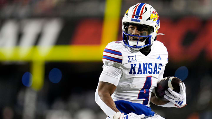 Kansas Jayhawks running back Devin Neal (4) scores a touchdown during the NCAA college football game.