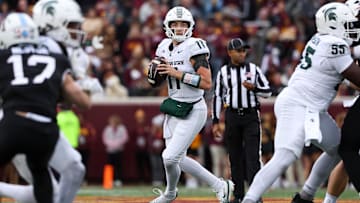 Nov 1, 2025; Minneapolis, Minnesota, USA; Michigan State Spartans quarterback Alessio Milivojevic (11) looks to pass against the Minnesota Golden Gophers during the first half at Huntington Bank Stadium. Mandatory Credit: Matt Krohn-Imagn Images