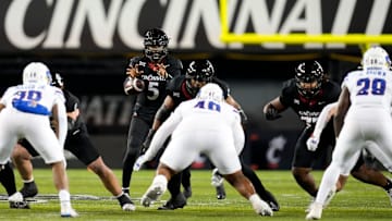 Cincinnati Bearcats quarterback Emory Jones (5) catches a snap during the NCAA college football game between the Cincinnati Bearcats and Kansas Jayhawks on Saturday, Nov. 25, 2023, at Nippert Stadium in Cincinnati. This is the Bearcats    last game of the season, as well as their Senior Night Saturday.