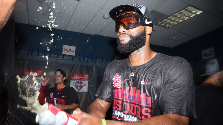 Sep 30, 2015; Pittsburgh, PA, USA; St. Louis Cardinals right fielder Jason Heyward (22) sprays a beverage as he celebrates after defeating the Pittsburgh Pirates to clinch the National League Central Division Championship at PNC Park. The Cardinals won 11-1. Mandatory Credit: Charles LeClaire-USA TODAY Sports