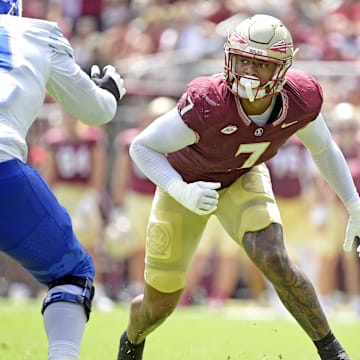 Sep 14, 2024; Tallahassee, Florida, USA; Florida State Seminoles defensive lineman Marvin Jones Jr. (7) pressures against the Memphis Tigers during the first half at Doak S. Campbell Stadium. Mandatory Credit: Melina Myers-Imagn Images