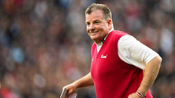 Miami (Oh) Redhawks head coach Chuck Martin runs onto the field 