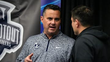 Xavier Musketeers head coach Sean Miller, left, speaks with Cincinnati Bearcats head coach Wes Miller after the Skyline Chili Crosstown Shootout Party on Thursday, Dec. 7, 2023, at Skyline Chili in downtown Cincinnati.