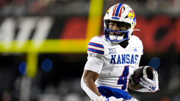 Kansas Jayhawks running back Devin Neal (4) scores a touch down during the NCAA college football game between the Cincinnati Bearcats and Kansas Jayhawks on Saturday, Nov. 25, 2023.