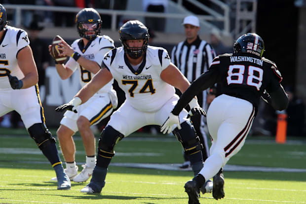 West Virginia Mountaineers offensive lineman Wyatt Milum (74) prepares to block.
