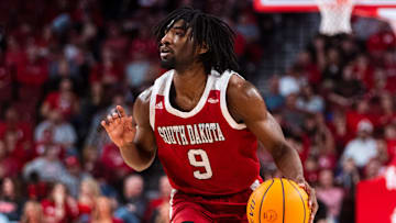 Nov 27, 2024; Lincoln, Nebraska, USA; South Dakota Coyotes guard Chase Forte (9) dribbles during the second half against the Nebraska Cornhuskers at Pinnacle Bank Arena. Mandatory Credit: Dylan Widger-Imagn Images
