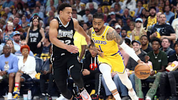 Apr 19, 2023; Memphis, Tennessee, USA; Los Angeles Lakers guard D'Angelo Russell (1) drives to the basket as Memphis Grizzlies guard Desmond Bane (22) defends during the first half of game two of the 2023 NBA playoffs at FedExForum. Mandatory Credit: Petre Thomas-Imagn Images